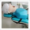 Dental Chair Mounted Phantom Head Manikin Dental phantom head strapped to dental chair for patient-style simulation training