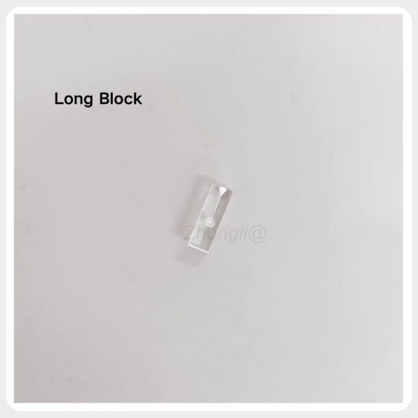 Long Endodontic Training Block Long transparent resin endodontic training block with a visible simulated root canal