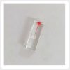 Transparent Resin Root Canal Training Block Detail Front view of a transparent resin practice block with a red-stained chamber and a simulated root canal that curves toward one side. The clear body makes the canal route easy to observe.