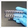 Multiple Simulated Root Canal Pathways Handheld transparent resin training block displaying multiple simulated root canal pathways